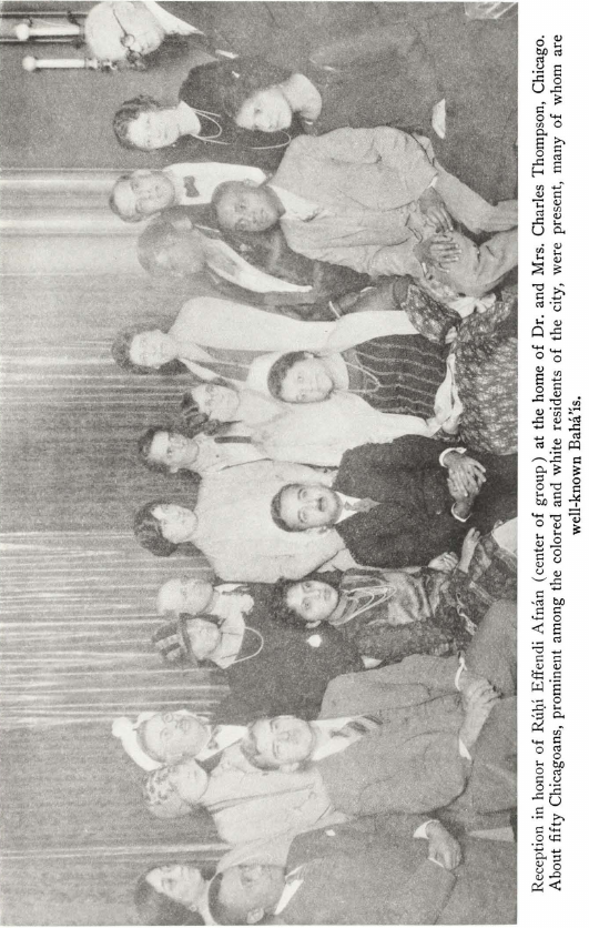 Reception in honor of Rúḥí Effendi Afnán (center of group) at the home of Dr. and Mrs. Charles Thompson, Chicago. About fifty Chicagoans, prominent among the colored and white residents of the city, were present, many of whom are well-known Bahá’ís.