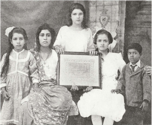 Bahá’í children of Karachi, India. Madam Shírází, Teacher.