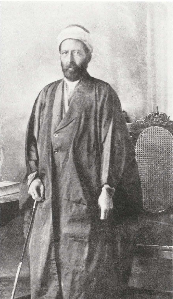 Haji Maḥmúd Qassábchí - President of the Baghdád, ‘Iráq, Spiritual Assembly for the past four years. He volunteered his services to undertake the reconstruction of the Sacred House of His Holiness Bahá’u’lláh, as desired by ‘Abdu’l-Bahá, and worked with great zeal to accomplish it. Besides his personal labor he contributed to this fund about half of the total expenditure. He owns the buildings surrounding the House and contemplates presenting them to the Cause.